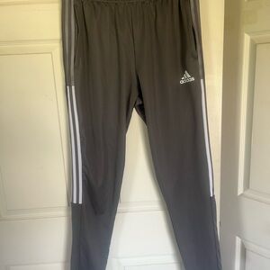 Men’s Size Large Primegreen Adidas Aeroready track pants with white stripes.